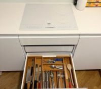 Kitchen induction hob and cutlery drawer