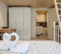 Reverse angle.  Large wardrobe for storage. 