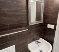 Bathroom sink with ornate mirror