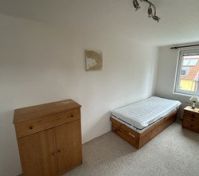 Bedroom with wooden furniture bed
