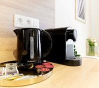 Kettle and coffee machine closeup