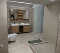 Bathroom with shower and storage
