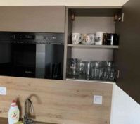Kitchen cabinet with mugs, glasses