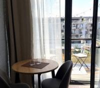 Dining table balcony door river view