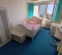 Bedroom with single bed and desk