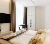 Bedroom with TV and wardrobe