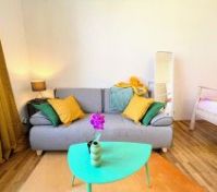 Sofa with teal coffee table