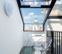 Glass terrace with church tower view