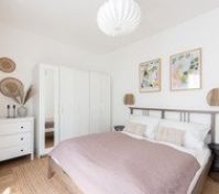Cozy bedroom with wardrobe and decor