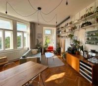 Living Room with a projector, coffee corner, reading nook, big dining table and more! 