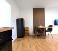 Kitchen dining area with fridge