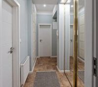Hallway with mirrored wardrobe doors