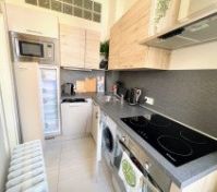 Kitchen with washer and hob