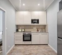 Modern white kitchen with oven