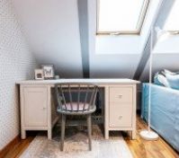 Desk workspace beside sofa skylights