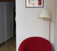 the bedroom has this char with standing lamp.