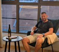 Guest relaxing in armchair