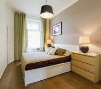 Cozy bedroom with green curtains