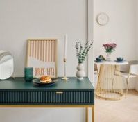 Console desk with dining area beyond
