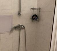 Shower with handheld sprayer