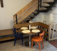 Dining table with wooden staircase