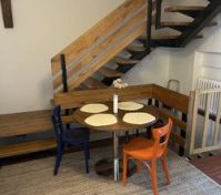 Dining table with wooden staircase