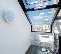 Glass balcony with city church view