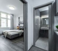 Look into the bedroom and bathroom