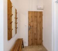 Entryway with wooden door mirror