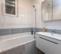 Bathroom with bathtub and sink