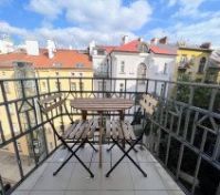 Balcony with city rooftop view