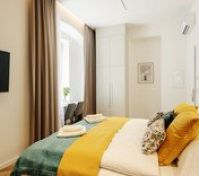 Bedroom with TV and wardrobe