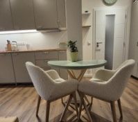 Dining area with kitchen behind