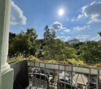 Balcony overlooking park and trees