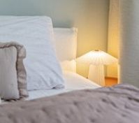 Bedroom closeup with bedside lamp