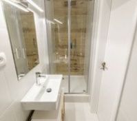 Bathroom with shower and sink