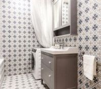 Bathroom with tub vanity washing machine