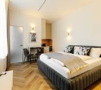 Apartment with bed and kitchenette