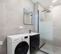 Modern bathroom with shower washing machine