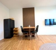 Dining table fridge and wall TV
