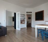 French doors connect the bedroom with the living room