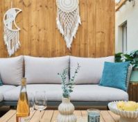 Outdoor sofa with dreamcatcher wall decor