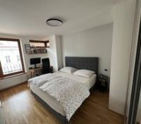 Bedroom with double bed and desk