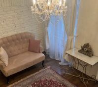 Elegant chandelier sofa Persian rug