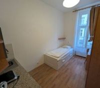 Single bed with kitchenette area