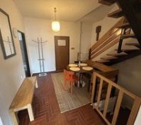 Entryway dining area with staircase