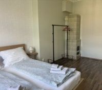 Bedroom with tiled stove