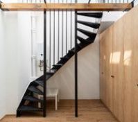 Black metal staircase with wardrobe