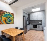 Dining area with kitchen beyond