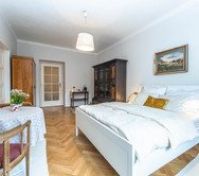 Spacious bedroom with antique wardrobes
